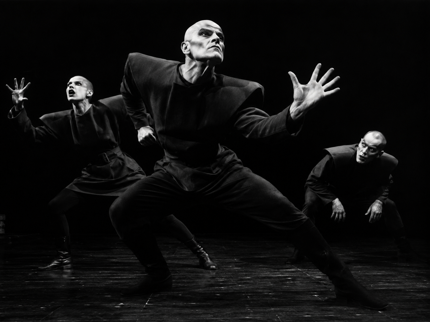 Berkoff-inspired physical theatre performers using bold, stylised movement